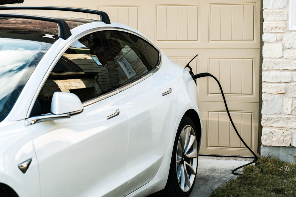 White Tesla Model Charging at Home